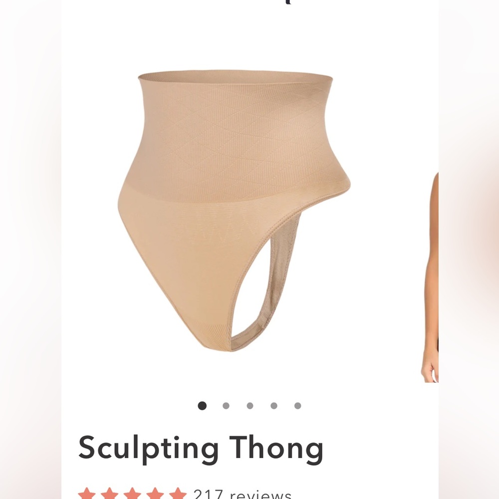 NEW sculpting thong. Still in package. Black. SMALL